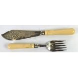 A PAIR OF LATE VICTORIAN FISH SERVERS, the EP blades floral pierced and bright cut engraved with