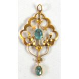 9ct GOLD OPEN WORK PENDANT set with centre oval blue zircon and with small oval blue zircon, 1.7