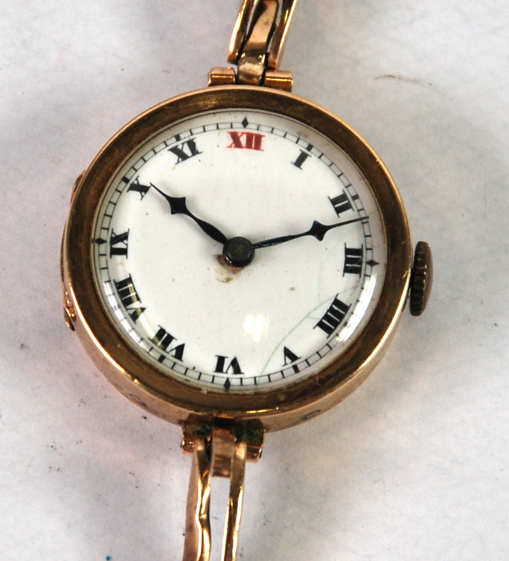 LADY'S 9CT GOLD WRIST WATCH with circular white Roman dial, 15 jewel Swiss movement and the 9ct gold