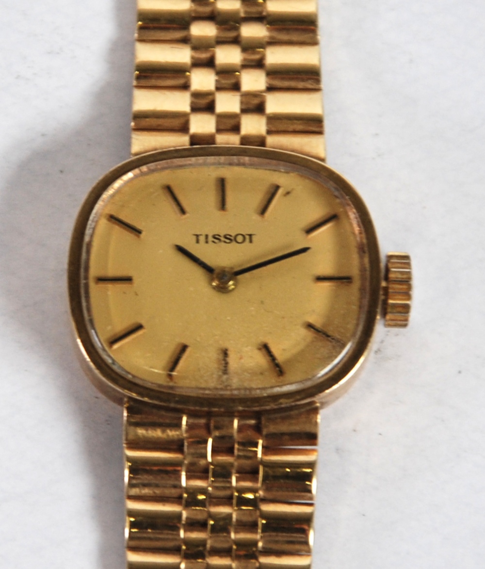 TISSOT LADIES 9CT GOLD CASED ANALOGUE WRIST WATCH the rounded oblong case with gilt dial and