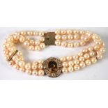 CHOKER NECKLACE FORMED OF THREE ROWS OF 98 MATCHED CULTURED PEARLS each approximately 9mm