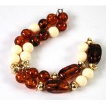 SINGE STRAND NECKLACE with twelve round amber beads, three long rectangular amber beads, ten round