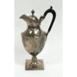 LATE VICTORIAN SILVER PEDESTAL HOT WATER JUG, of urn form with waisted upper section, black scroll