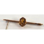 9ct GOLD BAR BROOCH set with a large centre oval citrine, 5.4gms and with safety chain