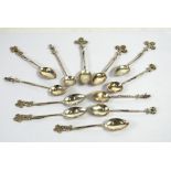 SET OF SIX SILVER COLOURED METAL TEASPOONS with pierced floral tops, TOGETHER WITH FIVE OTHERS,