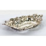 EDWARDIAN VII ROCOCO EMBOSSED SILVER BON BON DISH, of shallow oval form with Rocaille scroll