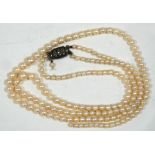 TWO STRAND NECKLACE OF GRADUATED CULTURED PEARLS with silver and marcasite clasp