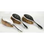 THREE SILVER CASED LADY'S HAIRBRUSHES, including a PAIR IN TORTOISESHELL, Birmingham 1917, the other