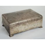 GEORGE V SILVER CASED TABLE CIGAR BOX, of typical form with chamferred and domed cover, and