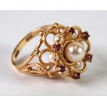 14K GOLD RING, the raised setting with six tiny rubies and seven pearls, 8.8 gms gross