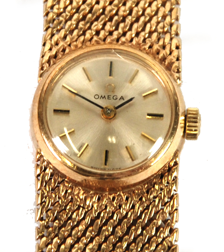 LADY'S OMEGA 9ct GOLD BRACELET WATCH, with mechanical movement, small circular silver dial with