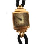 LADY'S 9CT GOLD SWISS WRIST WATCH, with 17 jewel movement, with rectangular silvered dial, leather