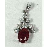18 CT WHITE GOLD , RUBY AND DIAMOND PENDANT, with a setting of eight small diamonds in pyramid