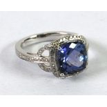 14k WHITE GOLD, TANZANITE AND DIAMOND RING, set with a centre cushion cut tanzanite, approx 4ct