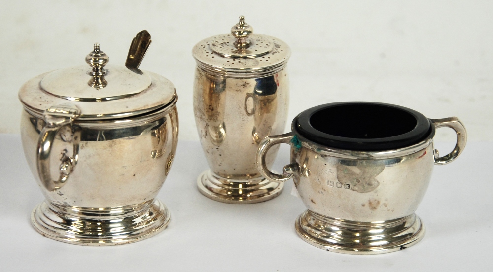 THREE PIECE SILVER CONDIMENT SET, of circular footed form, the two handed SALT and lidded MUSTARD