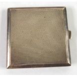 LADY'S SMALL SQUARE SILVER POWDER COMPACT with engine turned decoration; plain edges, 2 1/8" square,