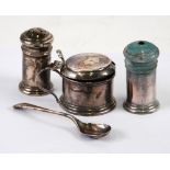 A SILVER CONDIMENT SET OF THREE PIECES small, plain and cylindrical with domed tops, on a