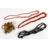 SINGLE STRAND NECKLACE of graduated coral beads and gold pearls; branch coral necklace; long
