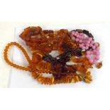 *THREE ROUGH COPAL AMBER NECKLACES, 187g gross, A SILVER FRAMED AMBER PENDANT, A SILVER MOUNTED