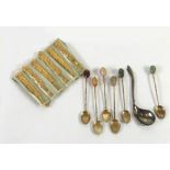 SET OF SIX GOLD PLATED CAST METAL OLIVE FORKS, the rustic handles having rose pattern tops; SET OF