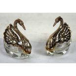 PAIR OF CUT GLASS AND SILVER COLOURED METAL SWAN PATTERN SALTS, with cut glass bodies forming the