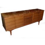 1960's ROSEWOOD SIDEBOARD, FITTED WITH FOUR GRADUATED CENTRE DRAWERS FLANKED BY CUPBOARDS, EACH