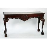 GEORGIAN STYLE MODERN REPRODUCTION CARVED DARK MAHOGANY SIDE TABLE, the oblong top with gadrooned