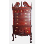 GEORGIAN STYLE MODERN REPRODUCTION CARVED MAHOGANY CHEST ON STAND, the ornate swan neck pediment