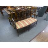 EARLY TWENTIETH CENTURY MAHOGANY TWO CHAIR BACK DRAWING ROOM SETTEE, the seat pad covered in pink