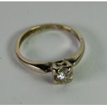 14k WHITE GOLD RING with a round brilliant cut solitaire diamond in a four claw square setting,