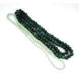 SINGLE STRAND NECKLACE OF PALE GREEN JADE GRADUATED BEADS, 25" long and a CONTINUOUS SINGLE STRAND
