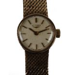LADY'S LONGINES 9ct GOLD WRIST WATCH, with mechanical movement, the small circular silvered dial