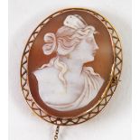 9ct GOLD FRAMED OVAL SHELL CAMEO BROOCH, carved with a classical female bust, the frame with zig zag