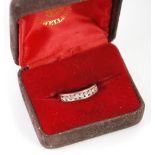 9ct GOLD RING set with a half hoop of nine tiny diamonds, 2.6gms (ring size N/O)