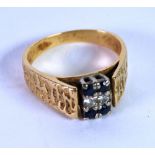 AN 18ct GOLD BARK TEXTURED RING, the square top set with two small diamonds between two pairs of