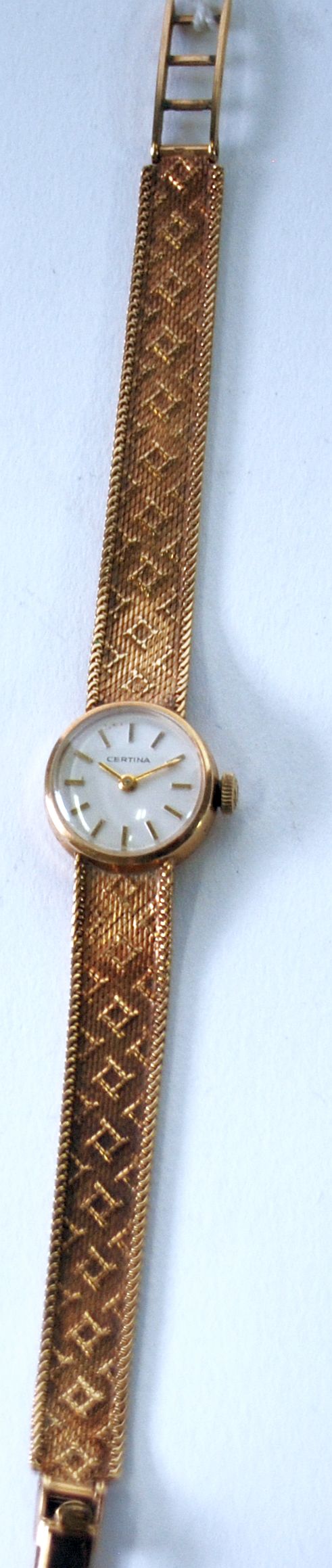 LADY'S CERTINA SWISS 9ct GOLD BRACELET WATCH with mechanical movement, small circular silvered