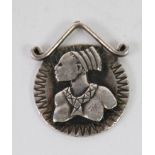 BIRGER HAGLUND (b.1918), STERLING SILVER PENDANT, of circular form with bust portrait of an