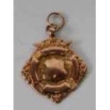 9ct GOLD CIRCULAR PRIZE MEDALLION with vacant cartouche and ring hanger, Birmingham 1914, 4.2gms