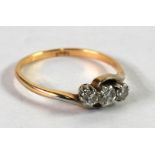 18ct GOLD CROSS OVER RING, set with three broad brilliant cut diamonds, approx .40ct in total,