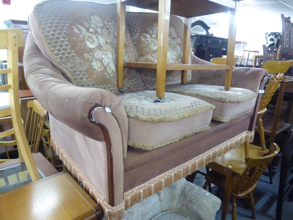 A TWO SEATER SETTEE COVERED IN PINK AND FLORAL CUT VELVET AND A LOUNGE CHAIR BUTTON UPHOLSTERED IN