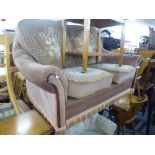 A TWO SEATER SETTEE COVERED IN PINK AND FLORAL CUT VELVET AND A LOUNGE CHAIR BUTTON UPHOLSTERED IN