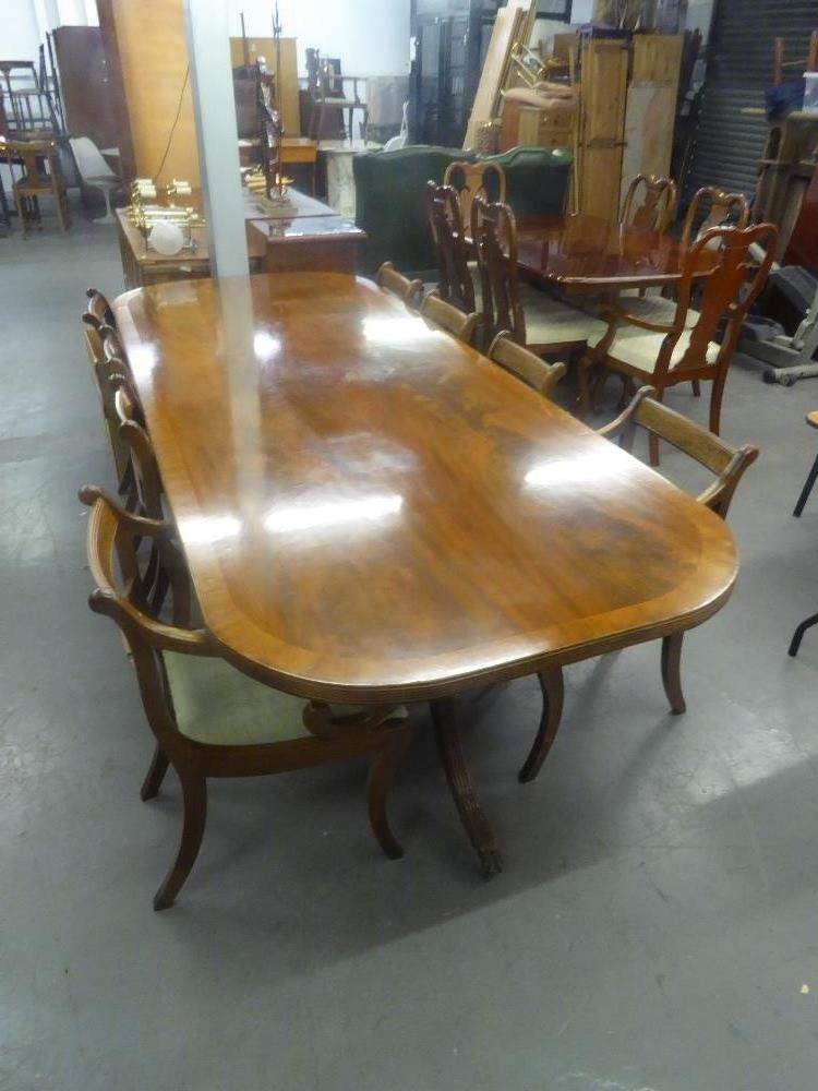 REGENCY STYLE FIGURED MAHOGANY LARGE DINING TABLE, THE ONE PIECE TOP HAVING 'D' ENDS AND CROSSBANDED