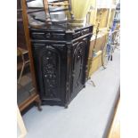 AN EBONISED LARGE SIDE CABINET WITH CANTED SIDES, 47" WIDE X 48" HIGH