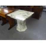 A KESTERPORT BLACK AND WHITE VARIEGATED MARBLE DINING TABLE WITH SQUARE TOP, ON HEAVY OCTAGONAL