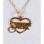 9ct GOLD HEART SHAPED OPENWORK PENDANT PATTERNED 'SOMEONE SPECIAL' on a 9ct gold fine chain