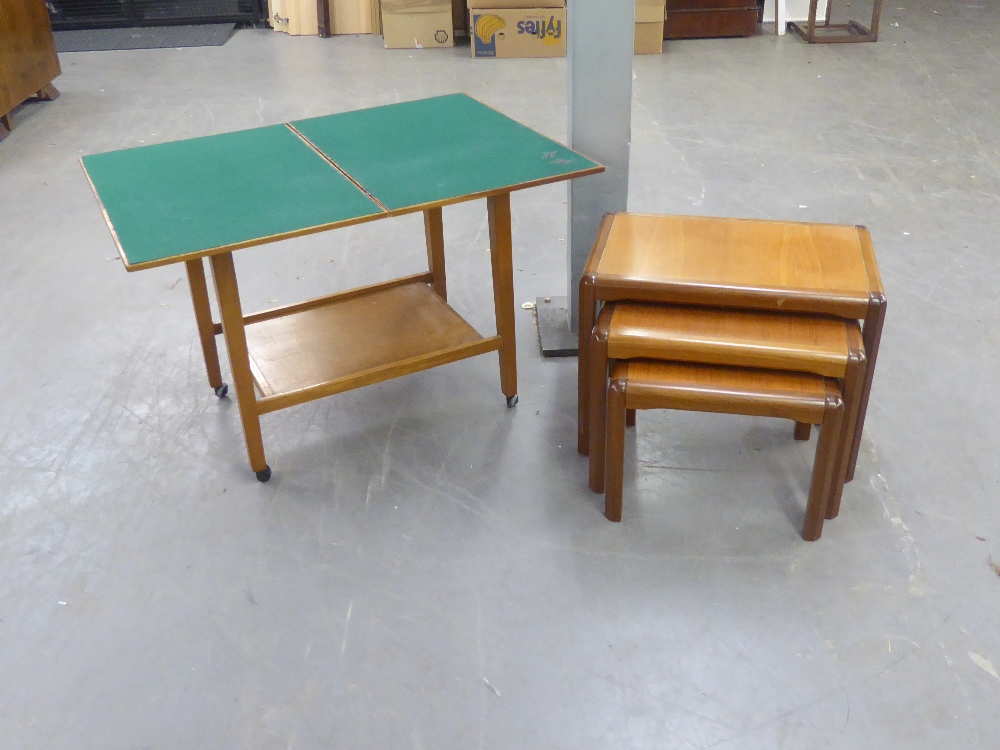 A NEST OF THREE MODERN TEAK WOOD OBLONG COFFEE TABLES AND A LOW TIER TROLLEY WITH SWIVEL AND FLAP-