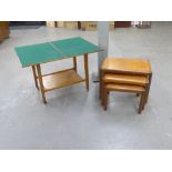 A NEST OF THREE MODERN TEAK WOOD OBLONG COFFEE TABLES AND A LOW TIER TROLLEY WITH SWIVEL AND FLAP-