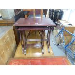 A NEST OF TWO MAHOGANY COFFEE TABLES WITH LYRE SHAPED SUPPORTS