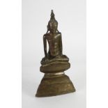 FAR EASTERN ANTIQUE BRONZE FIGURE OF BUDDHA modelled seated, on a stepped triangular base, 13 3/