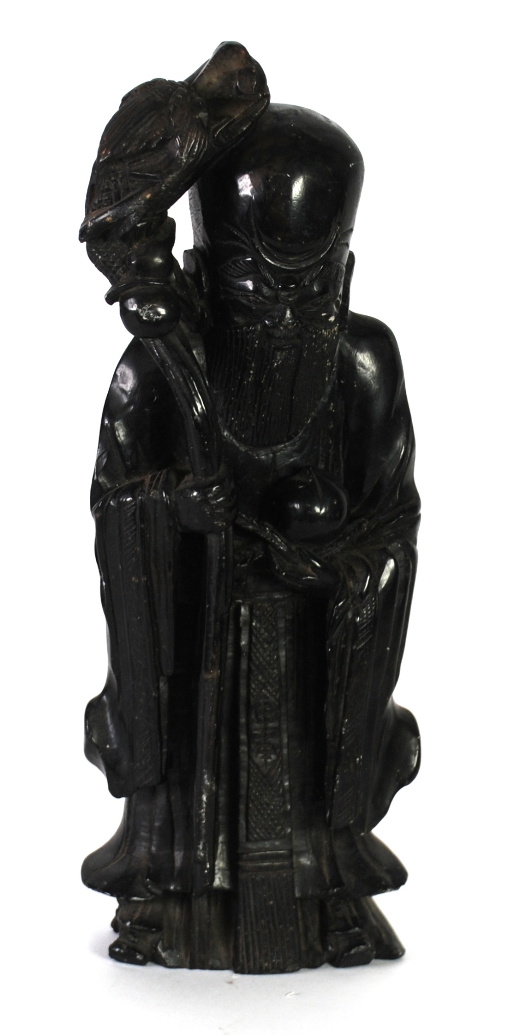 NINETEENTH CENTURY CHINESE CARVED HARDSTONE FIGURE OF A DEITY, modelled holding a persimmon fruit